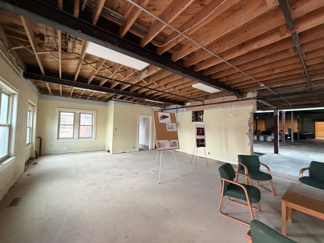 The original staircase and tall windows inside the Tribune Building